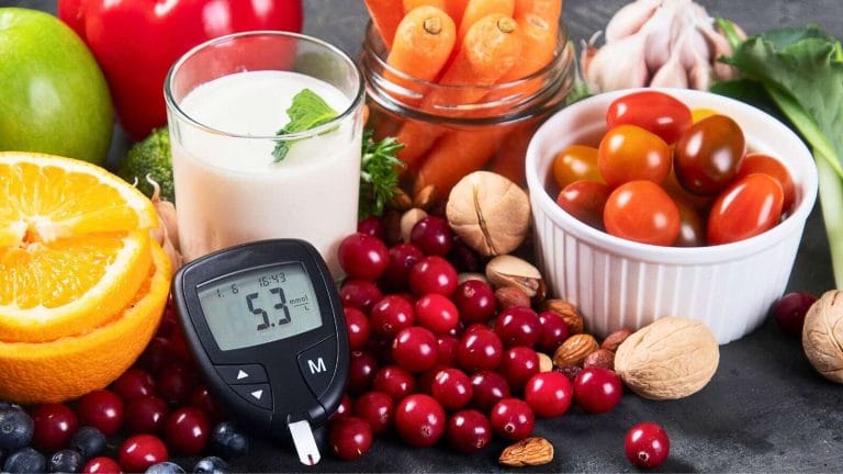 Best Foods to Lower Blood Sugar Naturally including berries, leafy greens, oats, salmon, avocado, nuts, and Greek yogurt.